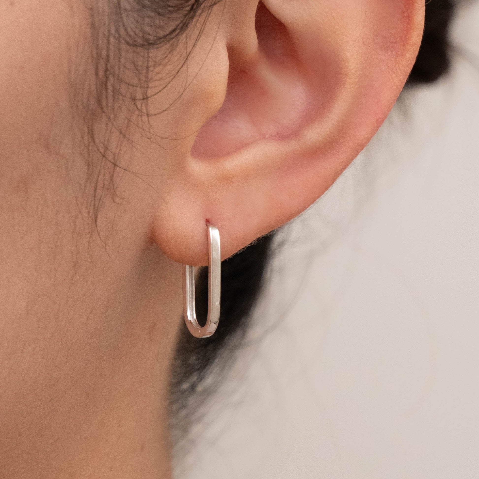 Presenting silver best-selling jewelry worn in one ear, emphasizing their stylish look.