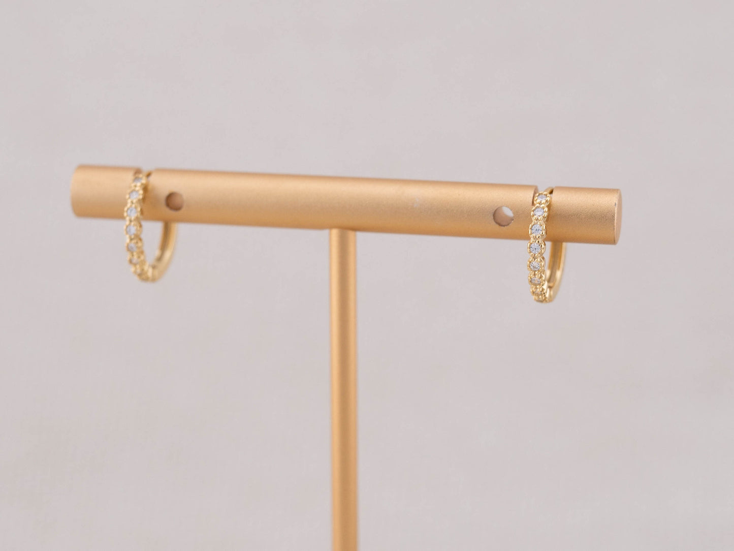 Gold huggy tiny diamond pave huggie hoop