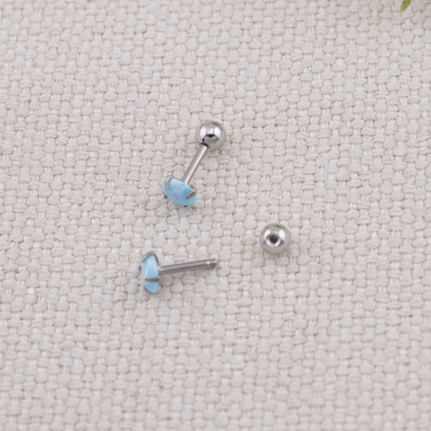 Small fire opal screw back titanium piercing