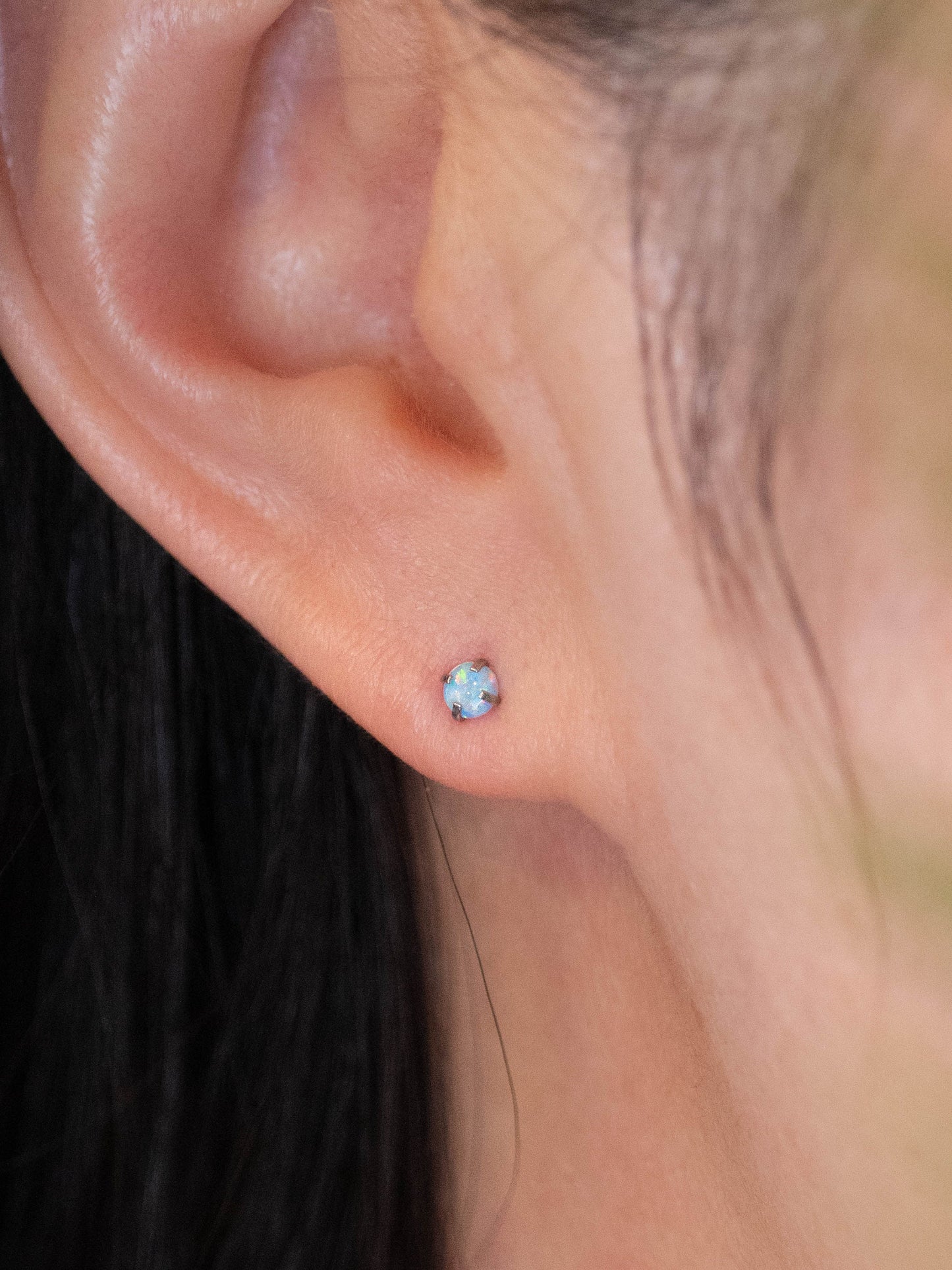 Small fire opal screw back titanium piercing