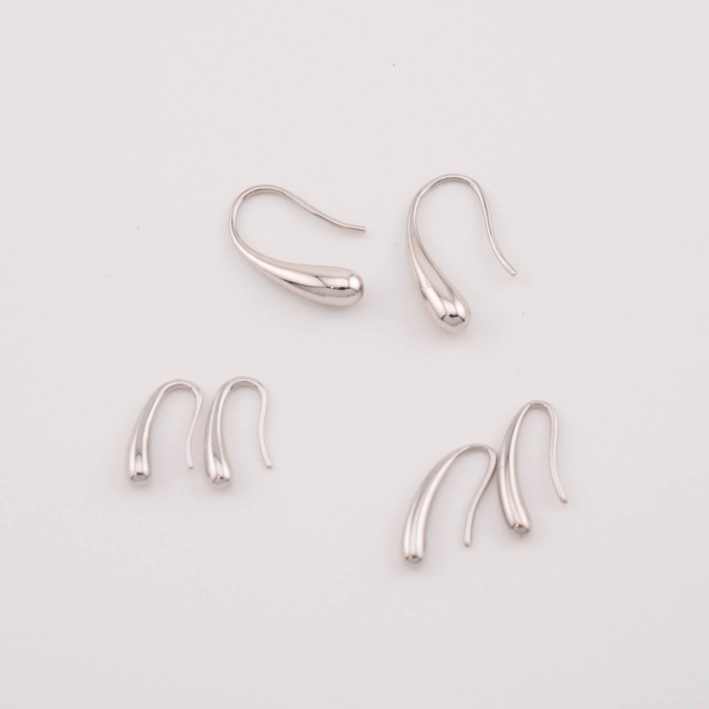 Simple Sterling silver drop cheap earrings, 3 pairs in different sizes, top view.