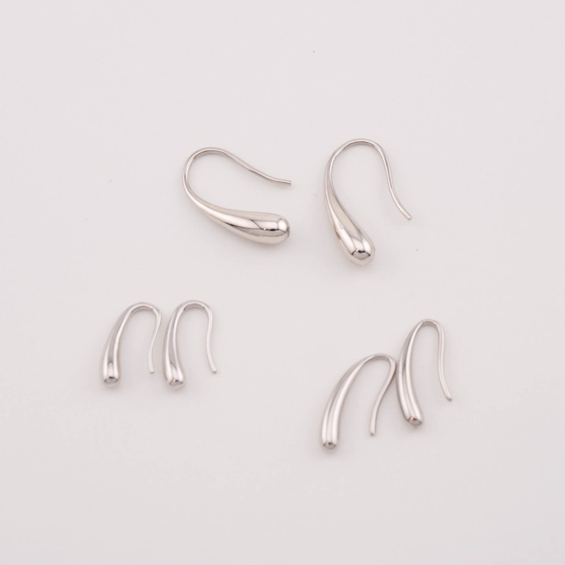 Simple Sterling silver drop cheap earrings, 3 pairs in different sizes, top view.