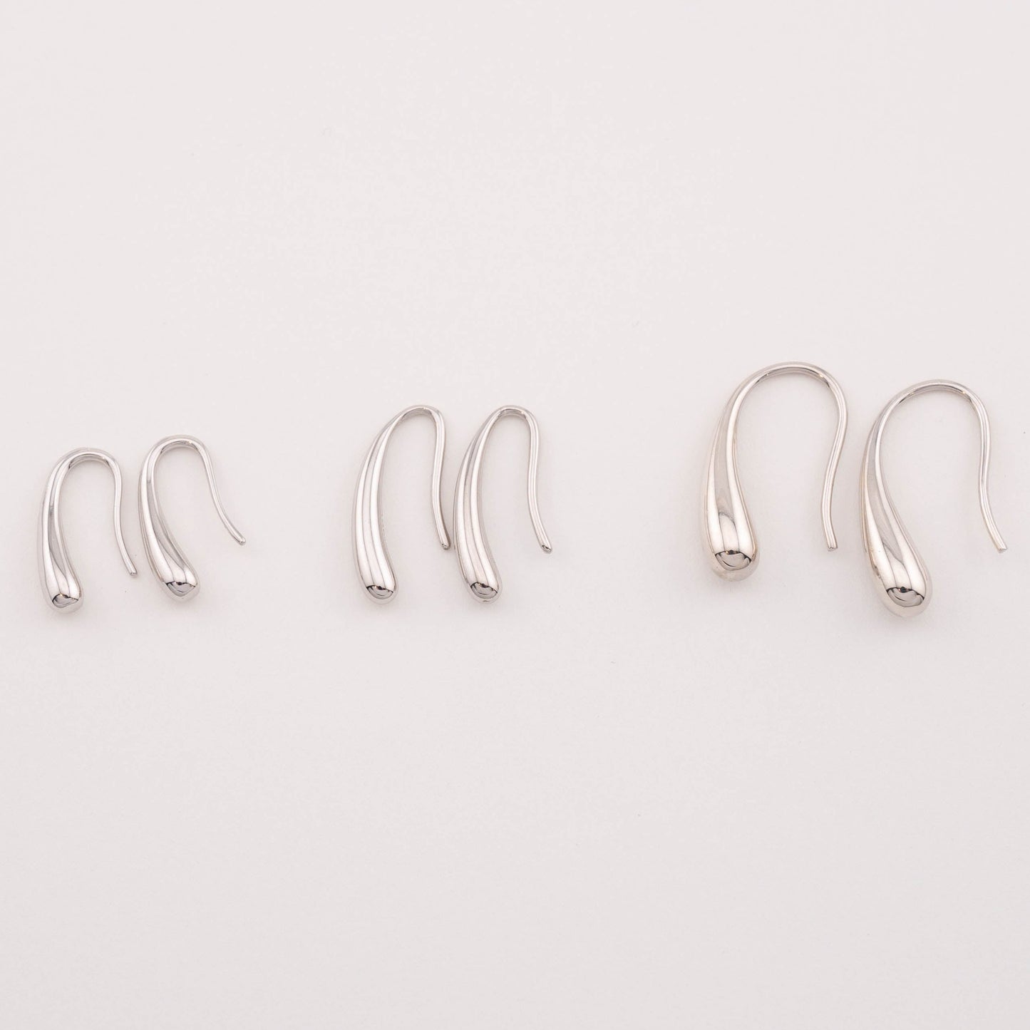 Top view of various size options for everyday wear sterling silver tear drop earrings