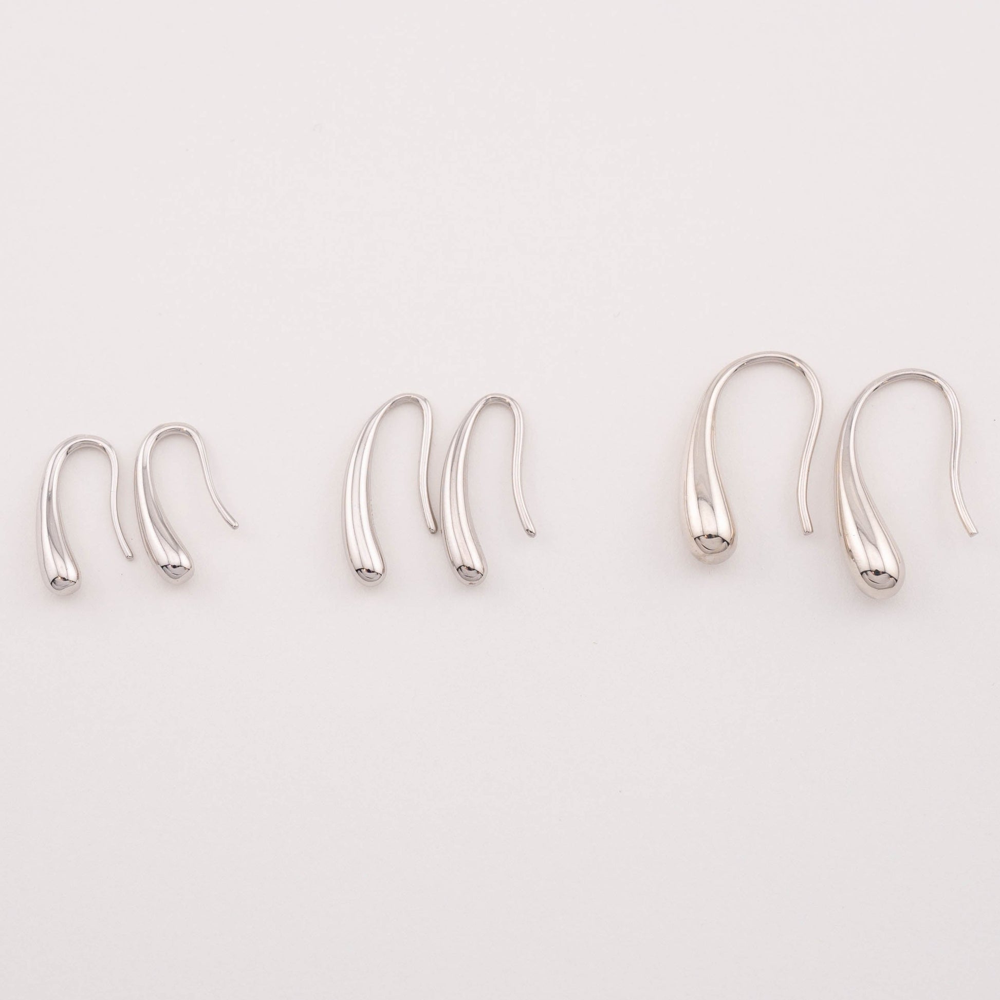 Top view of various size options for everyday wear sterling silver tear drop earrings